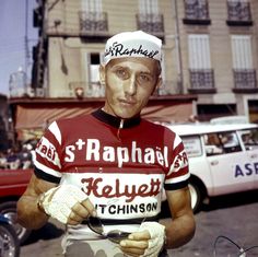 a man in a red and white jersey holding a spoon