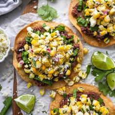 three corn and black bean tostadas with cilantro, avocado wedges