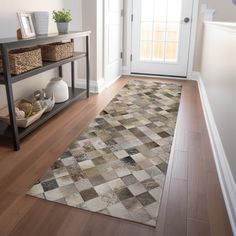 a large rug is on the floor in front of a door with baskets and vases