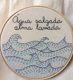 a cross stitch pattern with words written in spanish on the front and back of it