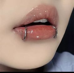 a woman's lips are covered with shiny liquid