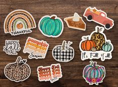 many different stickers on a wooden surface with the words happy fall and pumpkins