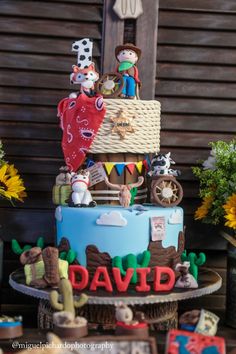 a birthday cake decorated with toys and decorations