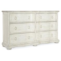 an old white dresser with drawers and handles on it's sides, against a white background