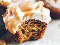 there are several desserts on the table with frosting and icing around them