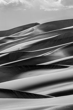 black and white photograph of sand dunes in the desert