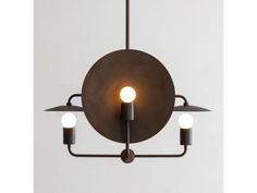 a light fixture with three lights hanging from it's center and two bulbs on each end