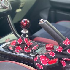 the interior of a car with red hearts on it's dash board and steering wheel