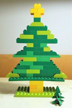 a lego christmas tree made out of green and yellow blocks