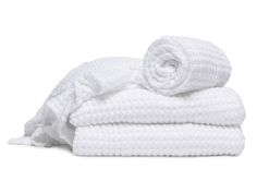 three white towels stacked on top of each other