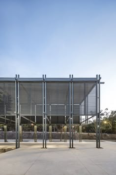 an open area with several metal poles on the ground