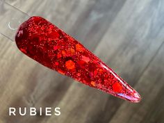 Rubies is a beautiful red chunky glitter dip powder.  Ruby is July's birthstone and a gorgeous shade of red.   Our Sizing Sample 1 tsp - 1-2 manis  Regular 5-7 manis  .25 oz (filled by weight) Large (solid colors only)   10+ manis  .5 oz  (filled by weight) The number of manis will depend on how many layers of dip you like.  We like 2 layers of dip for solids and most glitters.  Some glitters look great with just one dip.  All of our swatches have been dipped twice.   We add a layer of our Krystal clear dip on top of all glitters and foils. We suggest pouring dip into a cupcake liner, giving it a good mix and then giving it a little shake to bring any glitter or sparkles to the top.  For glitter dips, we like to turn our hand over and "lay" the finger down into the dip and then give everyt Red Chunky Glitter Nails, Chunky Sparkle Nails, Big Glitter Nails, Glitter Dip Powder Nails, Chunky Glitter Nails, Favorite Dips, The Dip, Glitter Dipped, Shade Of Red