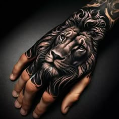 a man's hand with a lion tattoo on it