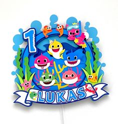 a cake topper with an image of the number one for luka's