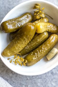 pickles in a white bowl with yellow flowers