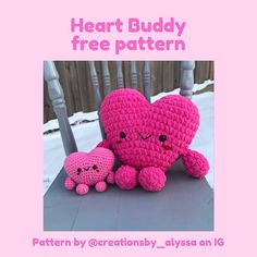 two crocheted hearts sitting next to each other on top of a table with the caption heart buddy free pattern