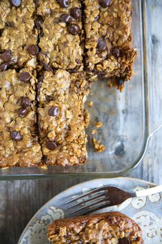 chocolate chip oatmeal cookie bars on a plate with a fork next to it