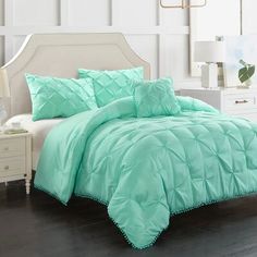 the comforter is aqua green and has ruffled edges