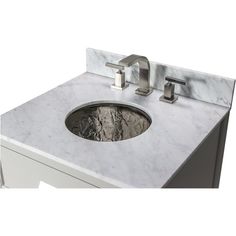 a marble sink with two faucets on it