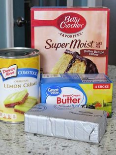 cake mix, butter, and jelly creme are on the counter next to a can