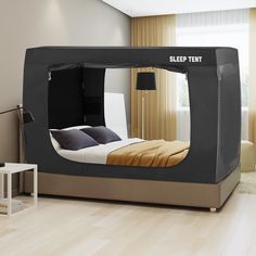 a bed that is in the middle of a room with a tent on top of it