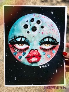 a painting of a woman's face with eyes and lips painted on the moon