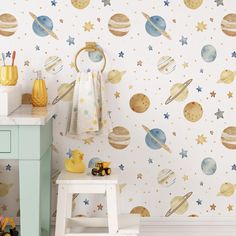 a child's room with space themed wallpaper