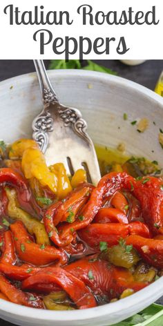 a white bowl filled with red and yellow peppers, garnished with parsley