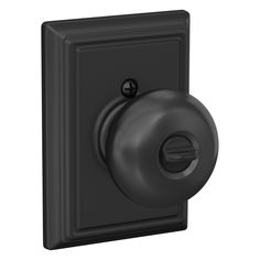 a black light switch with a round knob on the front and side of it's cover