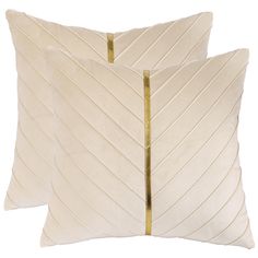 two white pillows with gold trims on them