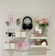 a white shelf with various items on it