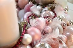 a candle and some ornaments on a table