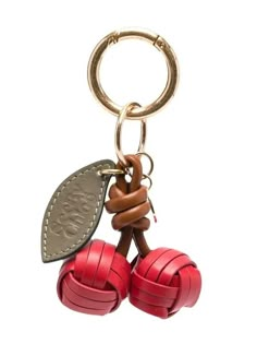 a key chain with two red rubber balls attached to it