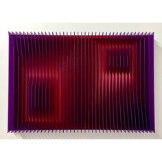 an abstract purple and red art piece on a white wall in the shape of rectangles