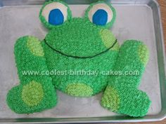 a cake shaped like a frog sitting on top of a pan