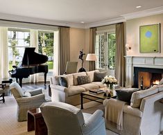 a living room filled with furniture and a piano