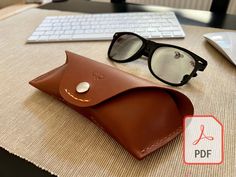 Protect your favorite sunglasses in style with our premium leathercraft sunglasses case PDF pattern! This comprehensive pattern is perfect for leathercrafters of all levels, creating a functional and stylish sunglasses case. Crafted from high-quality leather, this case features a durable construction that will safeguard your sunglasses from scratches and dust, making it ideal for everyday use or travel. With its sleek and minimalist design, this sunglasses case adds a touch of sophistication to your eyewear, while allowing for easy access and secure closure. Create a personalized accessory that matches your style or sell finished products to your customers. Download my leathercraft sunglasses case PDF pattern now and create a unique and luxurious protective case for your sunglasses! ✧ Item Diy Sunglasses Case, Leathercraft Pattern, Leather Sunglasses Case, Diy Sunglasses, Leather Craft Patterns, Sunglasses Holder, Leather Roll, Sunglass Holder, Stylish Sunglasses