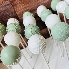 there are many green and white cake pops