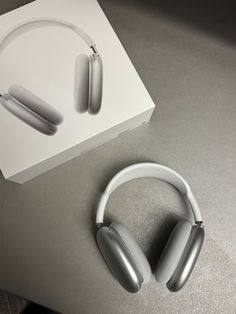 an open box with two headphones on it