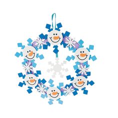 an ornament with snowflakes and penguins on it