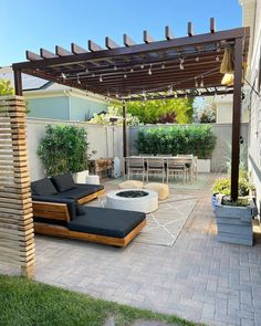 an outdoor living area with patio furniture and fire pit