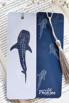 Show your love for the ocean with this whale shark double-sided bookmark. This bookmark features a larger whale shark swimming along the front, 3 smaller sharks on the back, and a beautiful silver tassel to compliment the deep blue colors. This bookmark is printed in full color on both the front and the back. Images shown depict the two different sides of this one bookmark. Designed and printed in the USA Whale Shark Linocut, Whale Shark Painting, Whale Shark Swimming, Whale Shark Drawing, Whale Shark Art, Whale Crafts, Dibujos Toy Story, Back Images, Small Shark