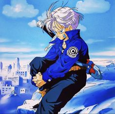 an anime character holding onto another character on a snowy hill with buildings in the background