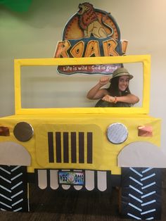 a woman in a yellow truck costume with the word roar on it's side