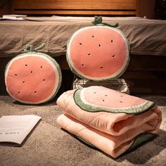 there are two pillows that look like watermelon slices on top of each other