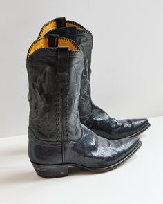 Used - Vintage - StingRay - 10.5 US - 13.5 Shaft.  These Black Stingray Boots are luxurious from top to toe. A soft black ranch hand leather compliments the sparkly black stingray leather accents on the vamp, pull straps, and collar of the boot. Every pair of Stallion Boots is handmade in El Paso, Texas. Each pair is delicately made with the utmost attention to detail from the painted soles to the handwritten size inside. Expertly hand crafted in El Paso, Texas, these boots have an elevated look Black Patent Leather Boots With Snip Toe, Black Patent Leather Snip Toe Boots, Fitted Snip Toe Boots For Galas, Black Goodyear Welted Boots For Galas, Designer Fitted Snip Toe Boots, Ranch Hand, Mens Cowboy, Harness Boots, Leather Accents