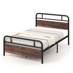 the bed frame is made out of wood and metal, with a white sheet on top