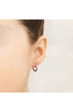 Easy-to-wear hoop earrings will add significant polish to even your most casual ensembles. 1/2" drop; 1/8" width Hinge with snap-post closure Sterling silver with goldtone plate/enamel Imported Everyday Single Enamel Earring, Hypoallergenic Enamel Jewelry For Everyday, Trendy Enamel Earrings For Everyday, Enamel Huggie Hoop Earrings For Pierced Ears, Everyday Enamel Hoop Earrings, Hoop Huggie Earrings In Enamel, Enamel Huggie Hoop Earrings, Small Hoop Enamel Earrings, Huggie Hoop Earrings