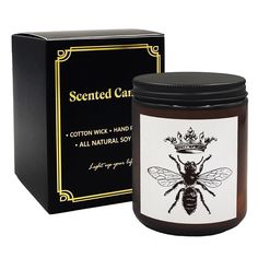 a jar of scented candles with a bee on it and a box behind it that says, scented candle cotton wick hand soap all natural soy