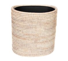 a round wicker waste basket with black lid on a white background for use as a planter